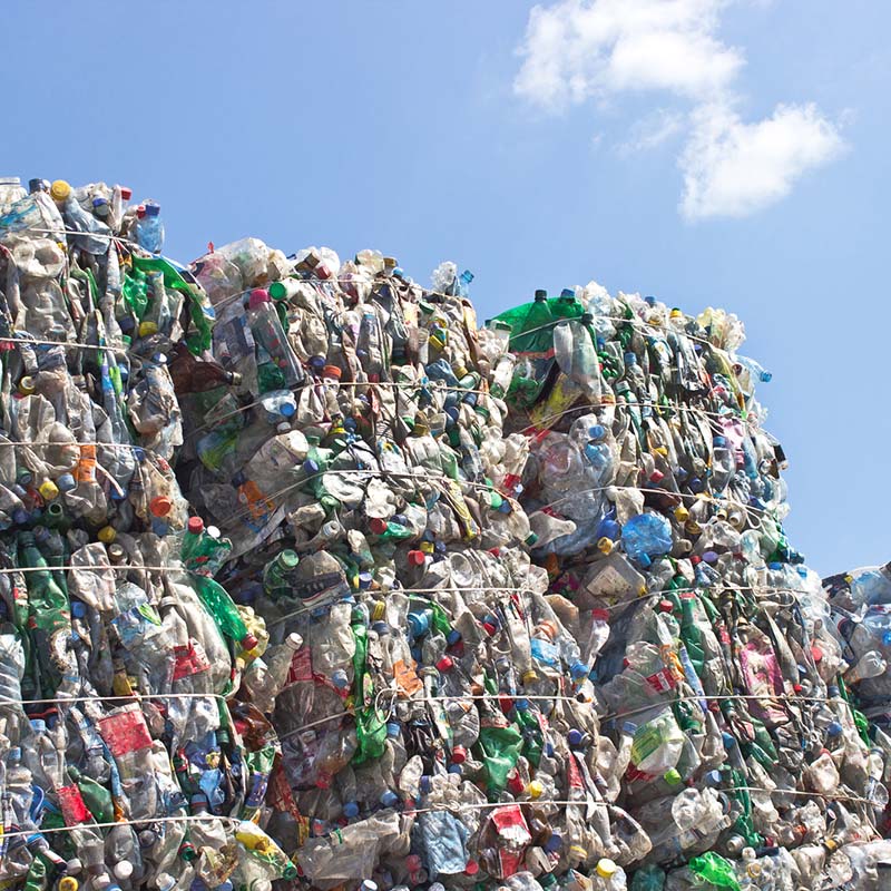 Crushed plastic bottles awaiting collection and recycling under the UK Deposit Return Scheme
