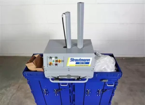 MK700 baler with cardboard in one chamber and plastic in the other.